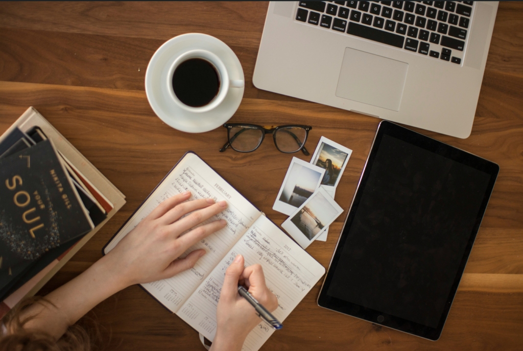 person writing in a notebook representing copywriting and content writing