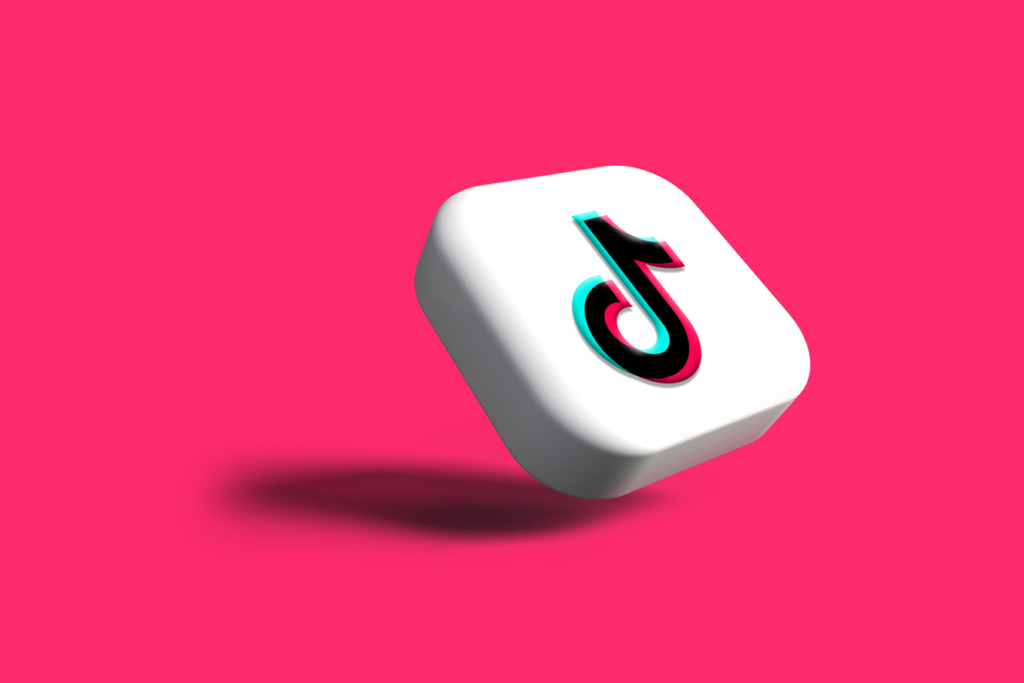 TikTok logo on a pink background representing viral content on tiktok