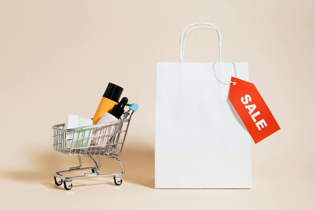 Full cart and a bag with Sale written on it representing Abandoned Cart Recovery Techniques